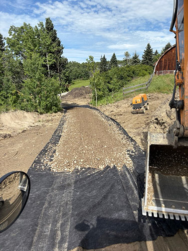 Image 3 - acreage development, road construction by 2 Sons Excavating, serving all excavating needs in and around Calgary, Alberta.